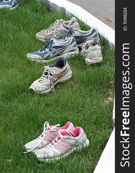 Sports footwear on a green grass of a lawn