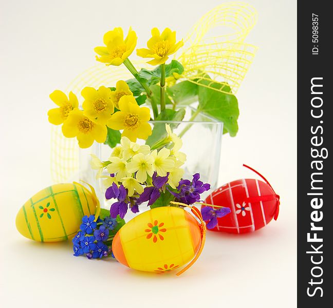 Easter eggs with flowers in vase