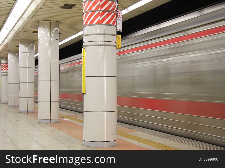 A long time shutter speed photograph of a underground train passing by the station in Tokyo. A long time shutter speed photograph of a underground train passing by the station in Tokyo.