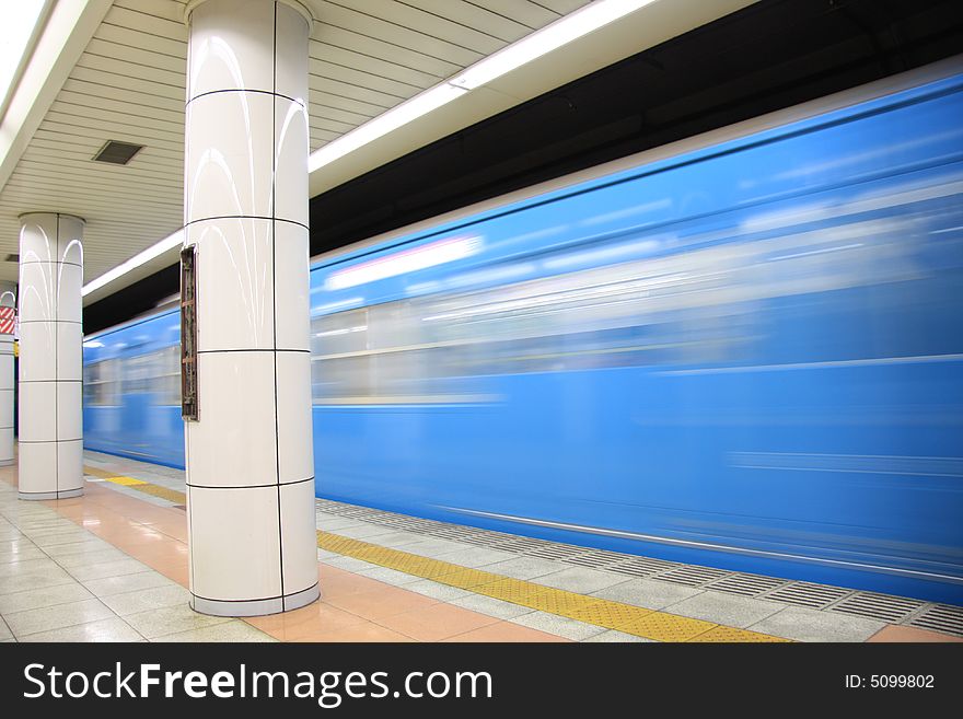 A long time shutter speed photograph of a underground train passing by the station in Tokyo. A long time shutter speed photograph of a underground train passing by the station in Tokyo.