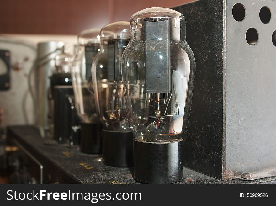Glass lamps in retro amplifier closeup