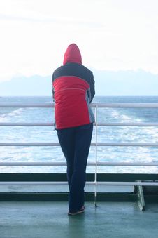 Alone Man In The Hood Standing At The Ferry And Looking At The Sea Stock Photography