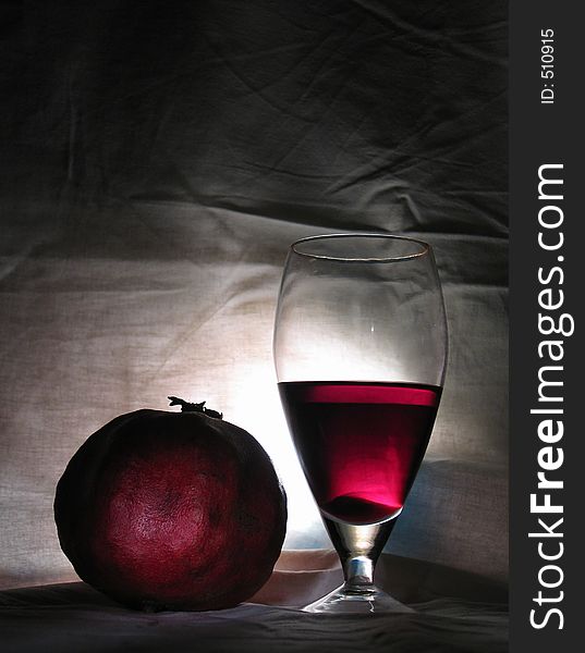 Home studio, a couple of sources of light, a piece of white textile, a pomegranate and a glass of good red wine - nothing more!. Home studio, a couple of sources of light, a piece of white textile, a pomegranate and a glass of good red wine - nothing more!