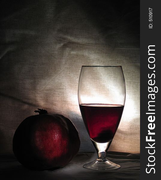 Home studio, a couple of sources of light, a piece of white textile, a pomegranate and a glass of good red wine - nothing more!. Home studio, a couple of sources of light, a piece of white textile, a pomegranate and a glass of good red wine - nothing more!