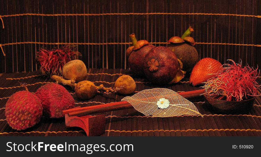 Some exotic fruits from Thailand, a couple of handmade mat and chopsticks (the work of anonymous Thai). Some exotic fruits from Thailand, a couple of handmade mat and chopsticks (the work of anonymous Thai).