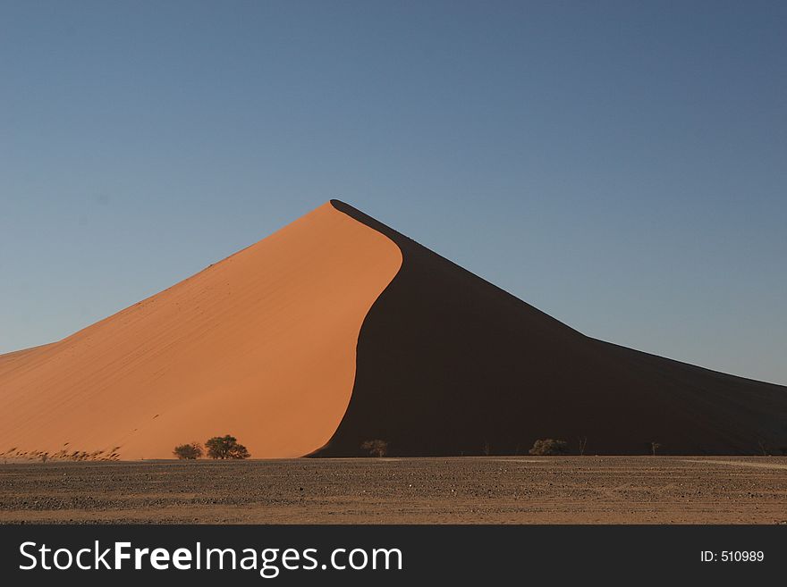 Sossusvlei sand dunes in Namibia taken in early morning sunlight. Sossusvlei sand dunes in Namibia taken in early morning sunlight