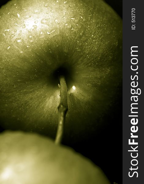 Green apples against a black background