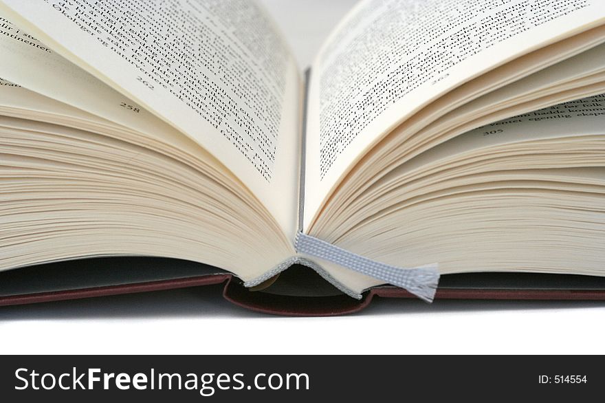 Book with open pages, shallow focus on text. Book with open pages, shallow focus on text