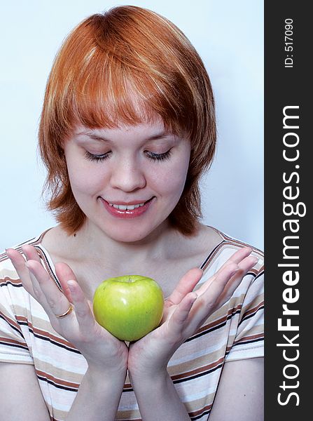 Red haired girl with green apple