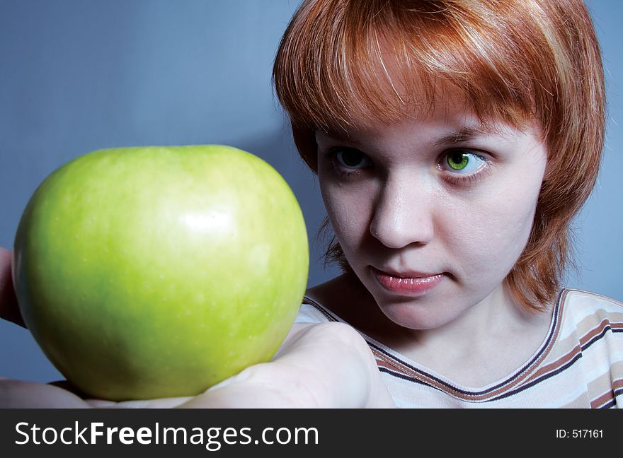 Red haired girl with green apple