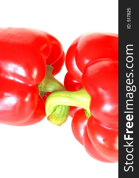 The Stems of Two Red Peppers are Linked. The Stems of Two Red Peppers are Linked.