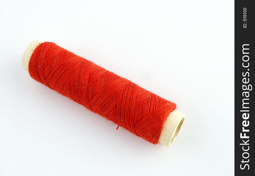 Red thread. Isolatred red object. Sewing thread
