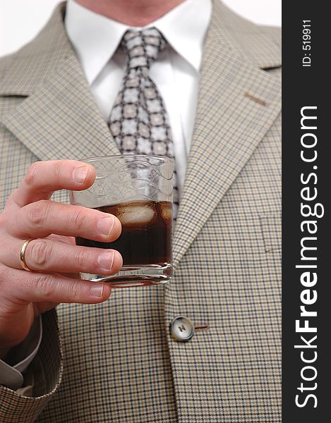Businessman celebrating something with a glass of drink. Businessman celebrating something with a glass of drink
