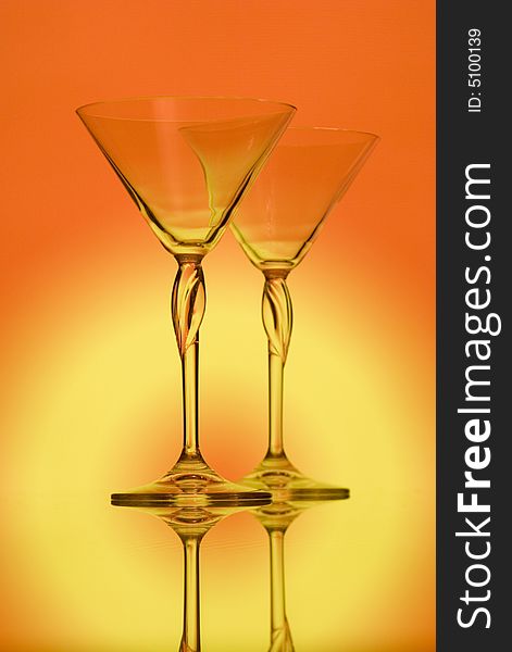 Two glasses for martini on gradient background