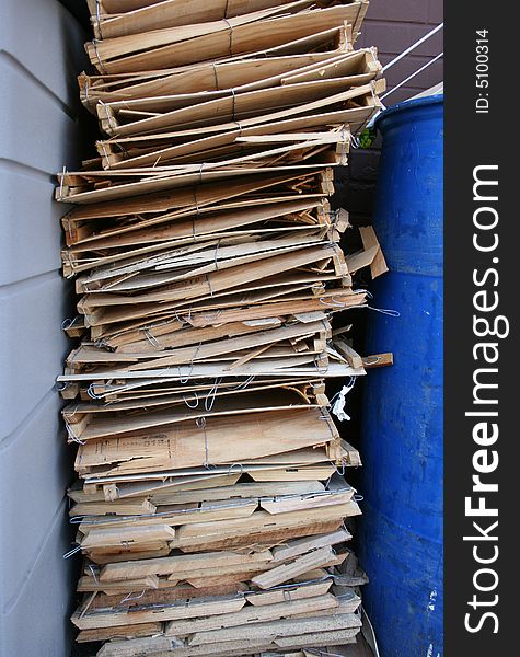 Wooden produce boxes are stacked and ready to be recycled. Wooden produce boxes are stacked and ready to be recycled.