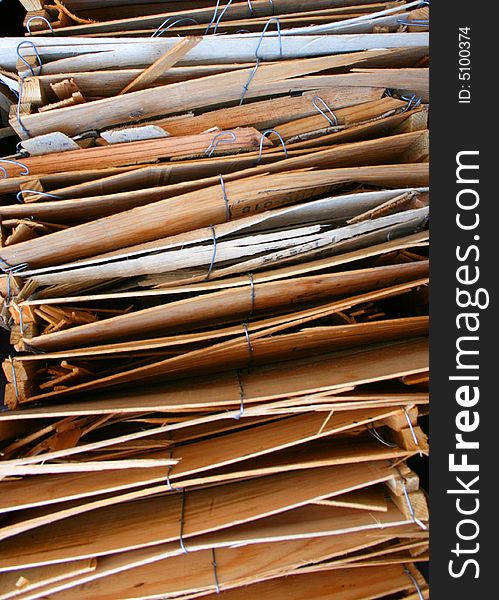 Stacked wooden produce boxes ready for recycling make an interesting background. Stacked wooden produce boxes ready for recycling make an interesting background.