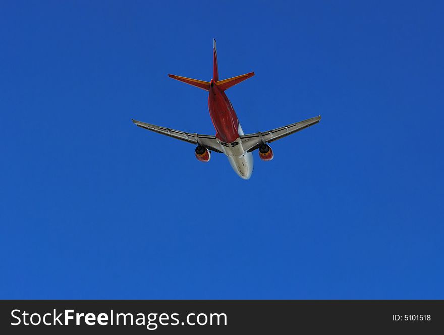 Red plane on the clear, blue sky. Red plane on the clear, blue sky.