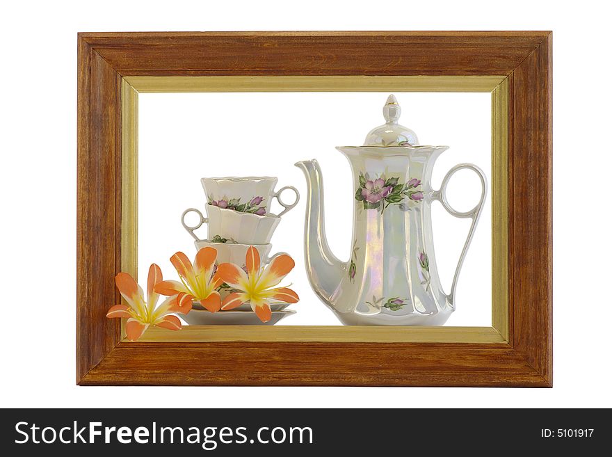 Teapot and cup within the framework against the white background. Teapot and cup within the framework against the white background
