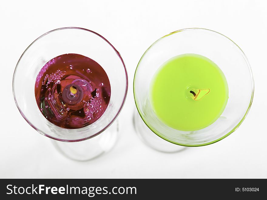 Red and green candles on the black background