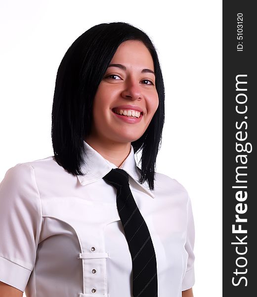 A portrait about a young pretty businesswoman with black hair who is smiling and she wears a white shirt and a black tie. A portrait about a young pretty businesswoman with black hair who is smiling and she wears a white shirt and a black tie