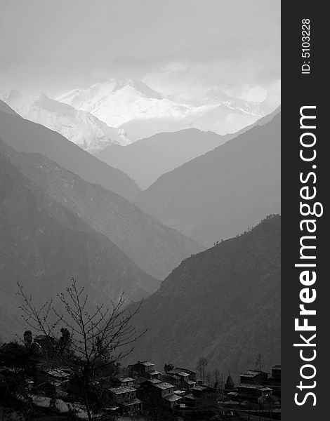 Mountain village in valley silhouette, himalayas, annapurna, nepal. Mountain village in valley silhouette, himalayas, annapurna, nepal