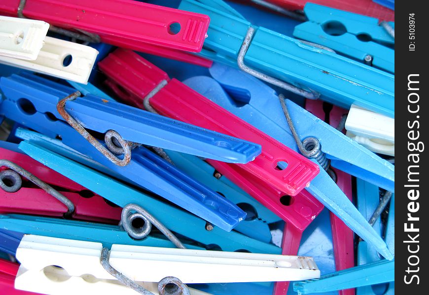 Blue, Pink and White Clothespins that have rusted with time. Blue, Pink and White Clothespins that have rusted with time