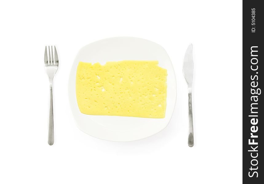 Cheese Ð¾n a dinner plate with fork and knife