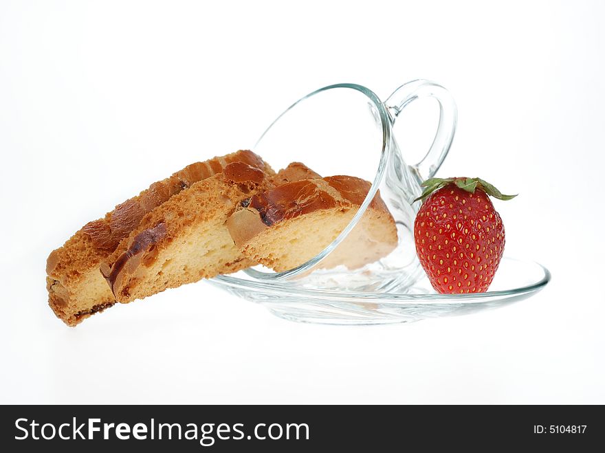 Biscotti in coffee cup with strawberry. Biscotti in coffee cup with strawberry