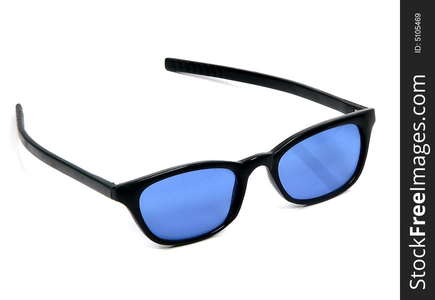 A modern pair of sunglasses with blue glass and black frame. A modern pair of sunglasses with blue glass and black frame