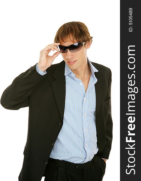 Handsome young businessman removing his sunglasses.  Isolated on white. Handsome young businessman removing his sunglasses.  Isolated on white.