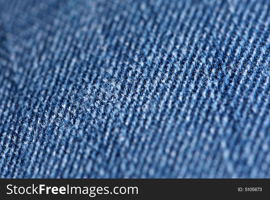 Blue jeans material close-up. Blue jeans material close-up