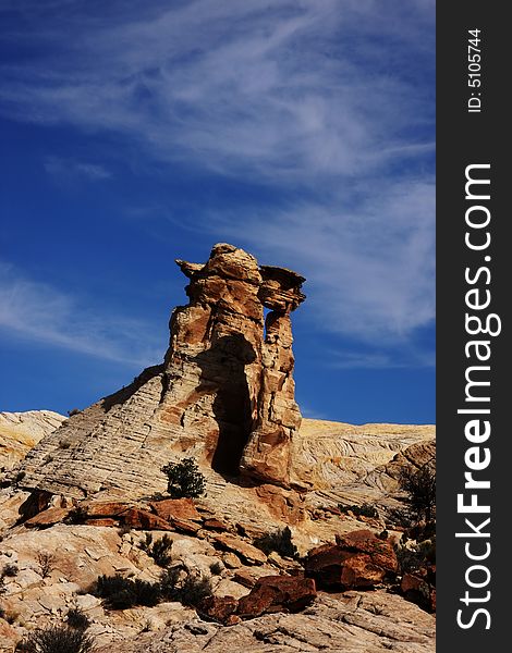 View of the red rock formations in San Rafael Swell with blue skyï¿½s and clouds. View of the red rock formations in San Rafael Swell with blue skyï¿½s and clouds