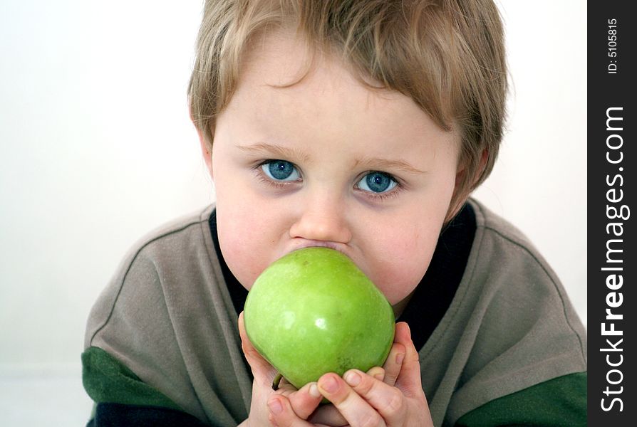 A little sweet boy with an apple