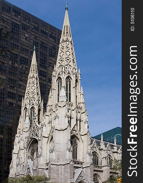 The facade of the Saint Patrick Cathedral in New York City, on a deep blue sky. The facade of the Saint Patrick Cathedral in New York City, on a deep blue sky