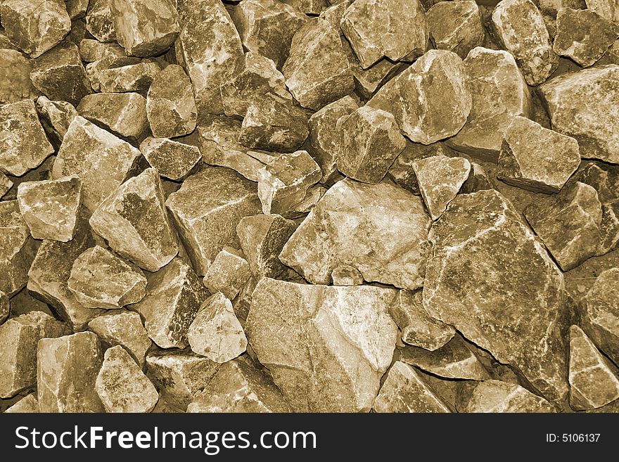 Rugged sepia rock wall background