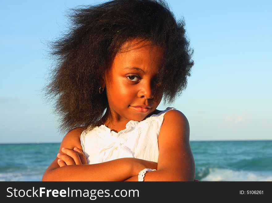 Young child with her arms crossed. Young child with her arms crossed