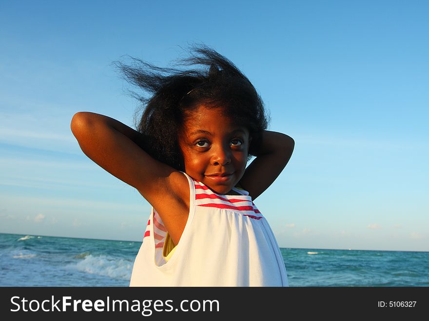 Child Posing On The Beach