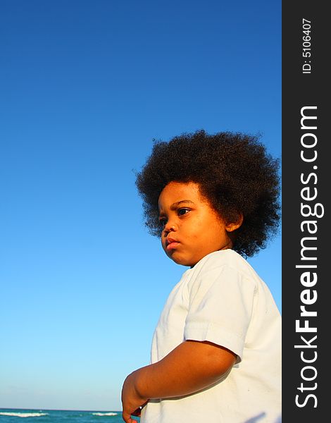 Young Child With Blue Sky Background