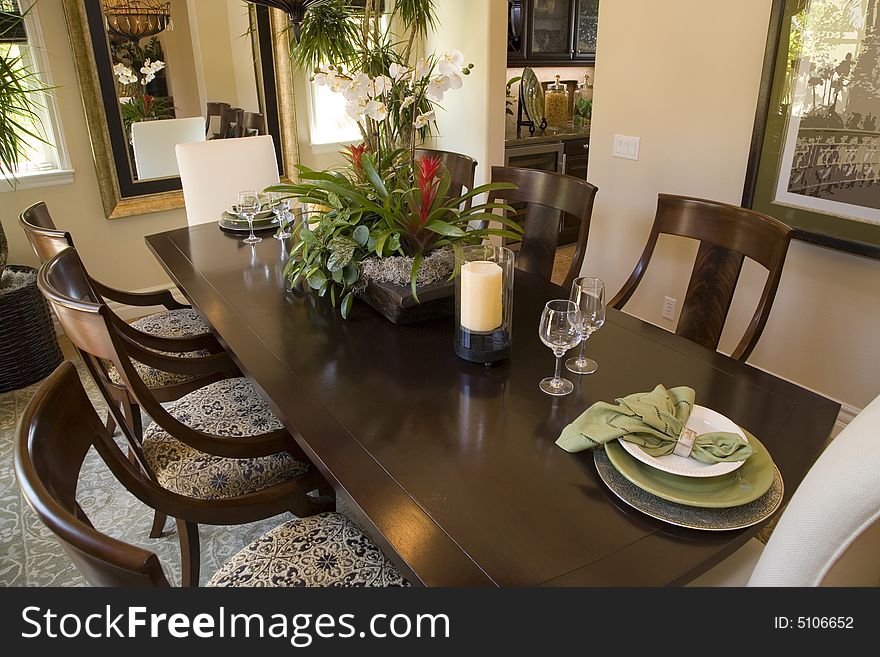 Luxury home dining table with modern tableware. Luxury home dining table with modern tableware.