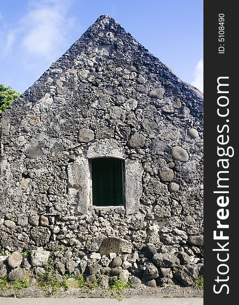 A stone house with an open window