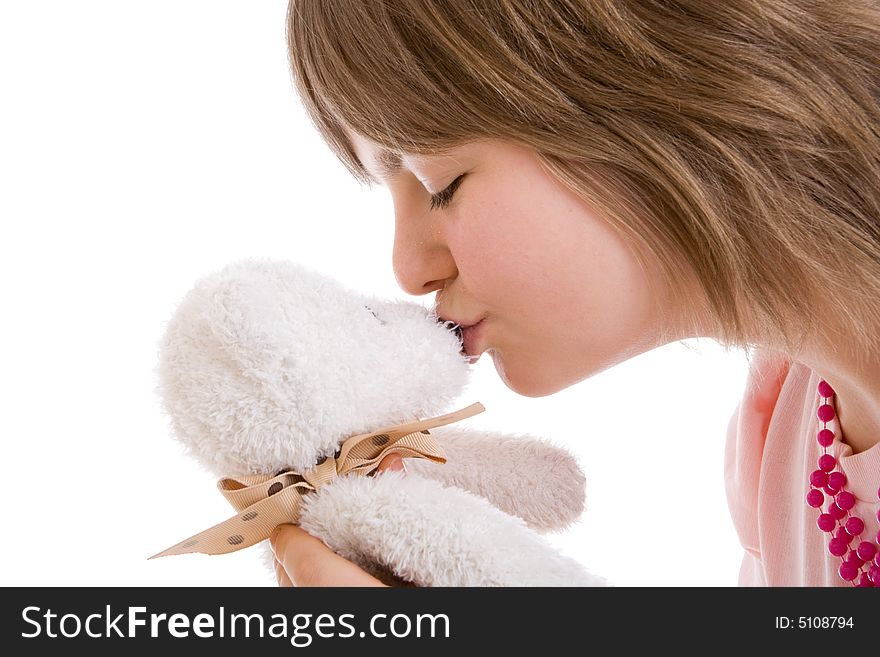 The young girl with a teddy bear isolated on a white background