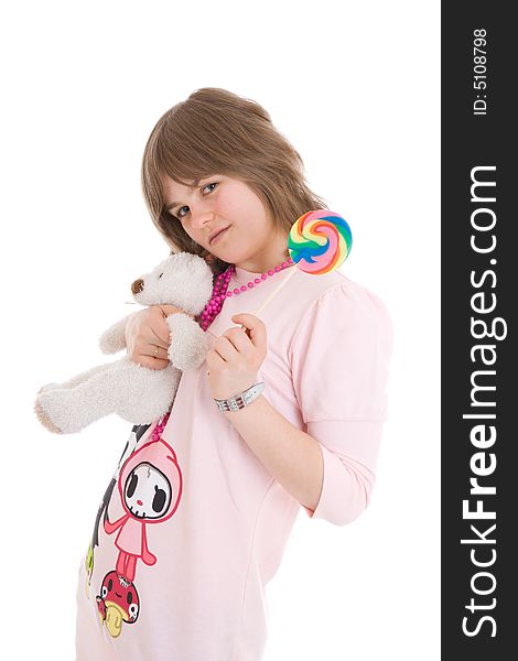 The girl with a sugar candy and teddy isolated on a white background