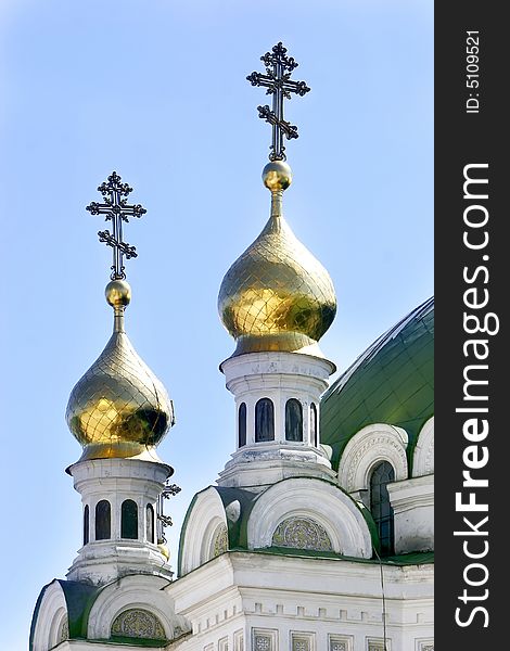 Orthodox crosses on blue sky background