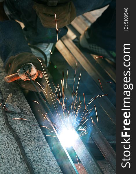 A welder working during night shift