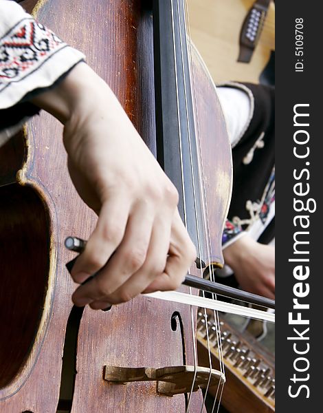 Close up of playing contrabass, focus on instrument
