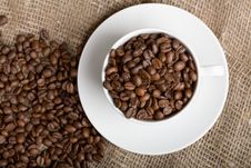 Cup With Freshly Roasted Coffee Beans On Sackcloth Royalty Free Stock Photo Cup With Freshly Roasted Coffee Beans On Sackcloth Royalty Free Stock Photo