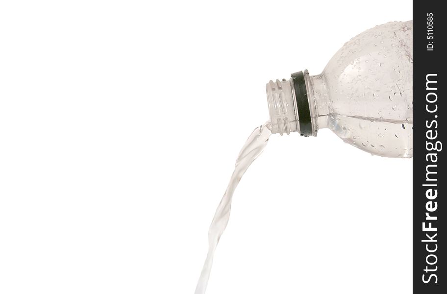 Water pouring from a plastic bottle isolated on white