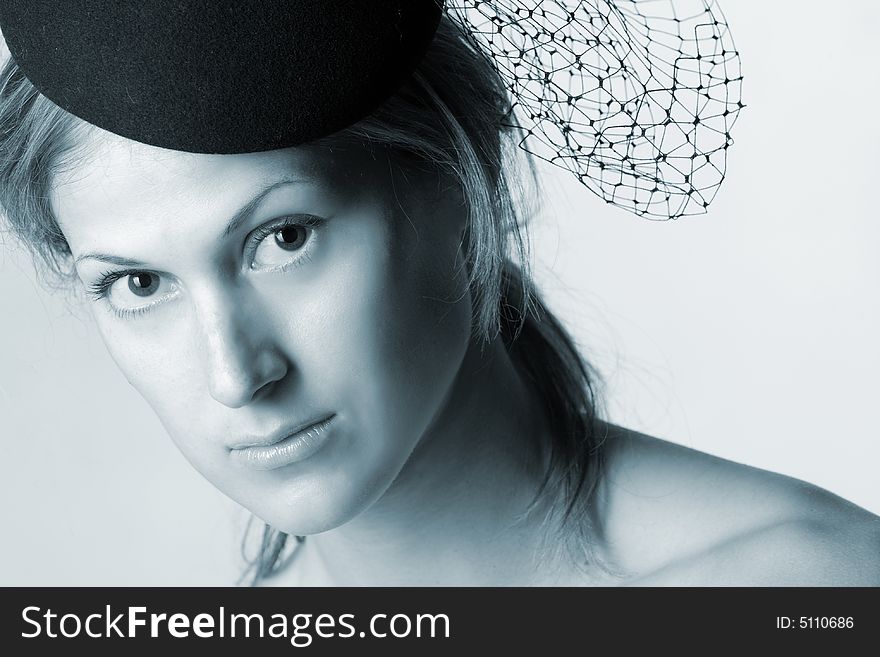 Retro styled portrait of pretty woman with veil