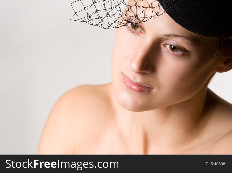 Retro styled portrait of pretty woman with veil