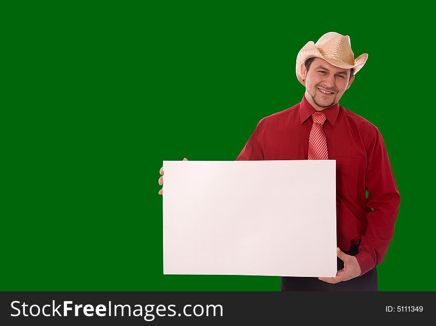 Cowboy holding empty message board over green